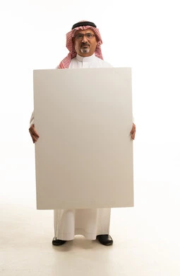Saudi Man Holding Blank White Sign on White Background