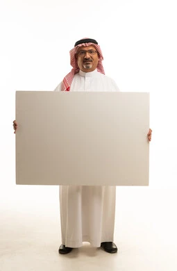 Saudi Man Holding Blank White Board Poster in Studio