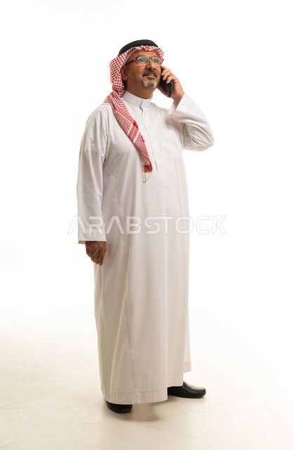 Saudi Man Talking on Smartphone White Background