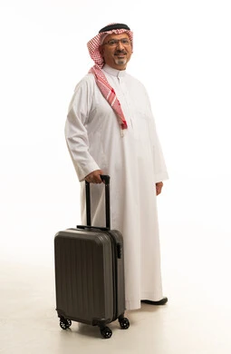 Saudi Man with Travel Suitcase on White Background