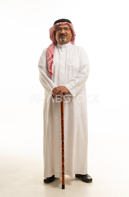 Elderly Saudi Man with Walking Stick on White Background