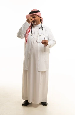 Tired Saudi Male Doctor Holding Glasses on White Background