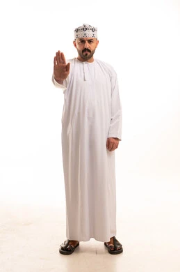 Omani Man in Traditional Dress Making Stop Gesture