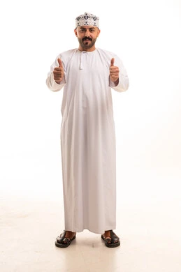 Omani Man in Traditional Dishdasha with Thumbs Up