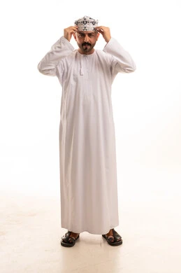 Omani Man in Traditional Dishdasha and Kumma Cap