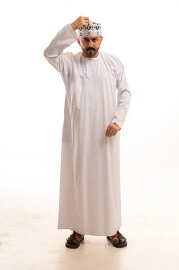 Omani Man in Traditional Dishdasha and Kumma Cap