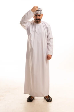 Omani Man in Traditional Dishdasha and Kumma Cap