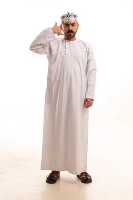 Omani Man in Traditional Dress Making Call Me Gesture