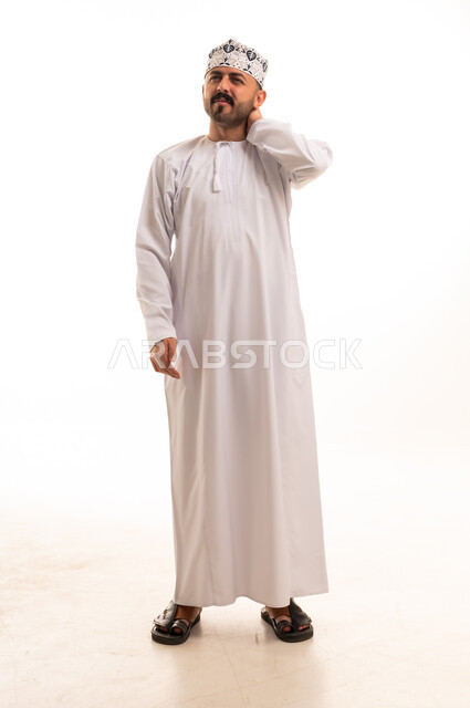 Omani Man in Traditional Dishdasha and Kumma Studio