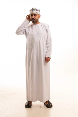 Omani Man in Traditional Dishdasha Listening on White