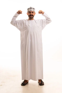 Omani Man in Traditional Dishdasha Flexing Muscles