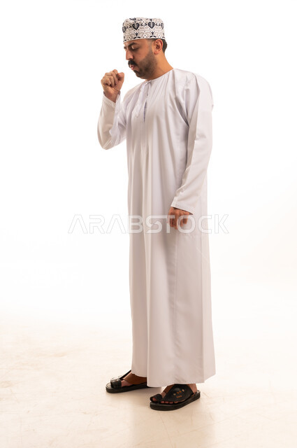 Omani Man in Traditional Dress Coughing Studio Shot