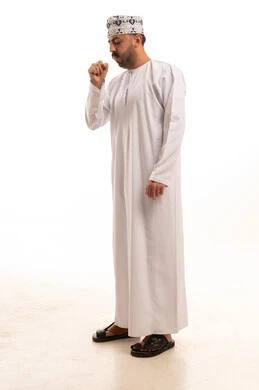 Omani Man in Traditional Dress Coughing Studio Shot