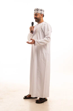 Omani Man in Traditional Dress with Microphone
