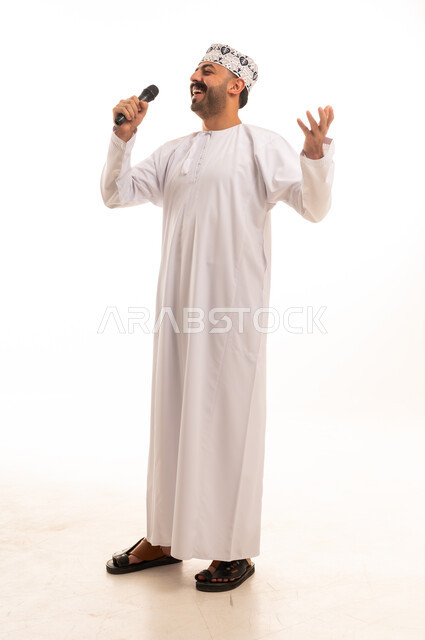 Omani Man Singing into Microphone in Traditional Dress