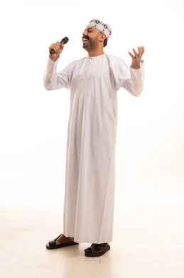 Omani Man Singing into Microphone in Traditional Dress