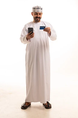 Omani Man with Credit Card and Smartphone Studio Portrait