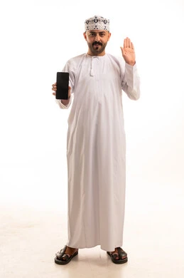 Omani Man in Traditional Dress with Smartphone White Background