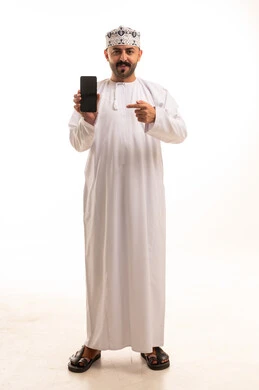 Omani Man in Traditional Dress Pointing at Smartphone