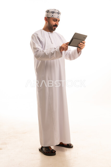 Omani Man with Tablet on White Background