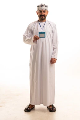 Omani Man in Traditional Dishdasha Holding ID Badge