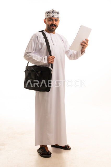 Omani Man in Traditional Dress with Laptop Bag