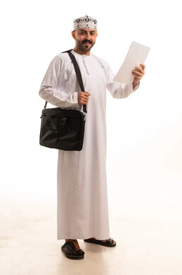 Omani Man in Traditional Dress with Laptop Bag