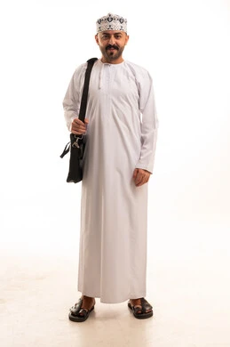 Omani Man in Traditional Dress with Laptop Bag