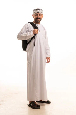 Omani Man in Traditional Dress with Backpack