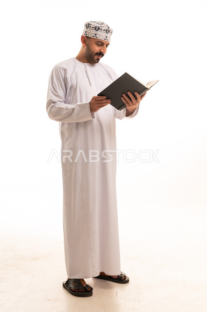 Omani Man Reading Book on White Background