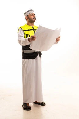 Omani Civil Engineer Holding Architectural Blueprint Studio