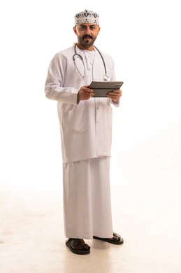 Omani Male Doctor Holding Tablet in White Studio