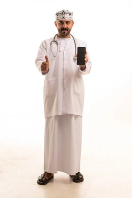Omani Doctor Holding Smartphone with Thumbs Up Gesture