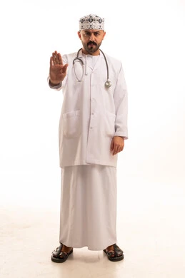 Omani Male Doctor Making Stop Gesture on White Background