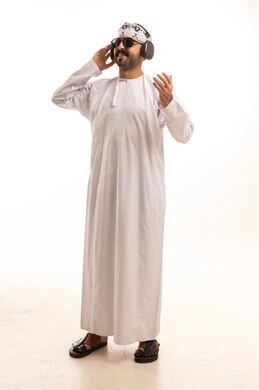 Omani Man with Headphones in Traditional Dishdasha