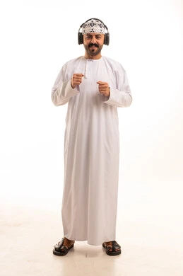 Omani Man in Traditional Dishdasha Wearing Headphones