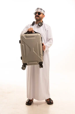 Omani Man in Traditional Dress with Travel Suitcase