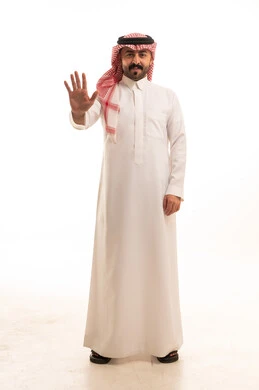 Saudi Man in Traditional Dress With Hand Gesture
