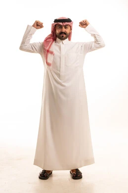 Saudi Man Flexing Muscles in Traditional Thobe