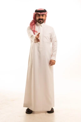 Saudi Man Reaching for Handshake in Traditional Dress