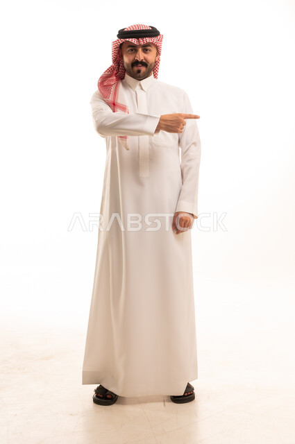 Saudi Man Pointing Aside on White Background