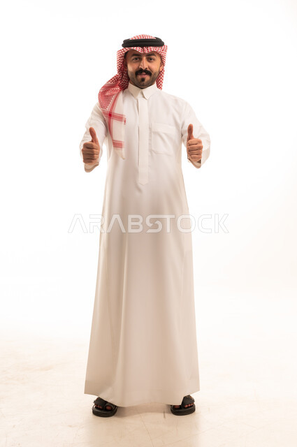 Saudi Man in Traditional Thobe Giving Thumbs Up