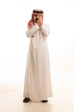 Saudi Man in Traditional Thobe Covering Eye Studio Shot