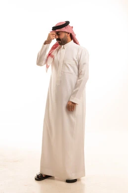 Stressed Saudi Man in Traditional Thobe with Headache