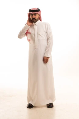 Saudi Man in Traditional Thobe Listening in Studio