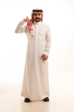 Saudi Man in Traditional Thobe Making Call Hand Gesture