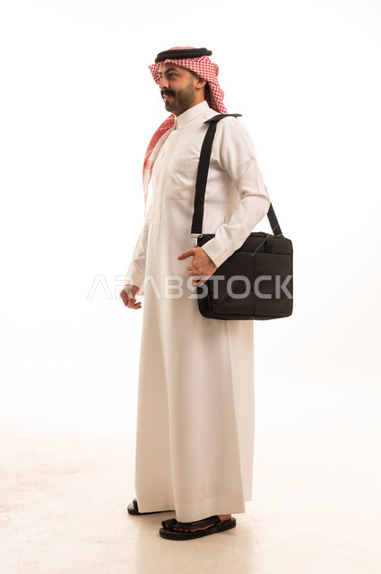 Saudi Businessman in Thobe with Laptop Bag Studio