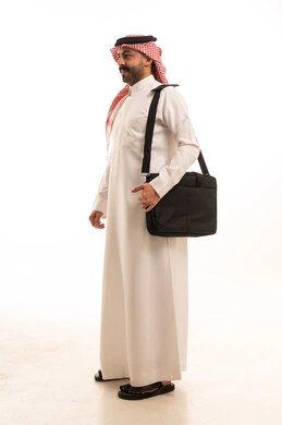 Saudi Businessman in Thobe with Laptop Bag Studio