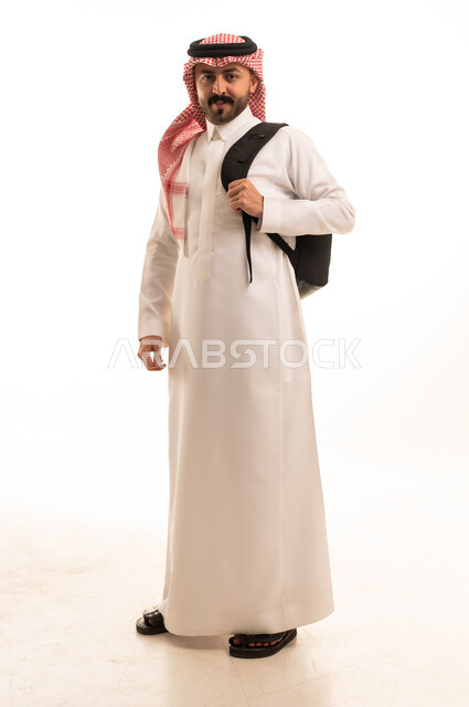 Saudi Man in Traditional Thobe with Backpack Studio Portrait