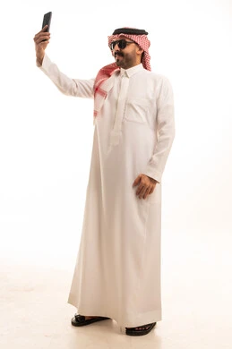 Saudi Man in Traditional Thobe Taking Selfie Studio Shot